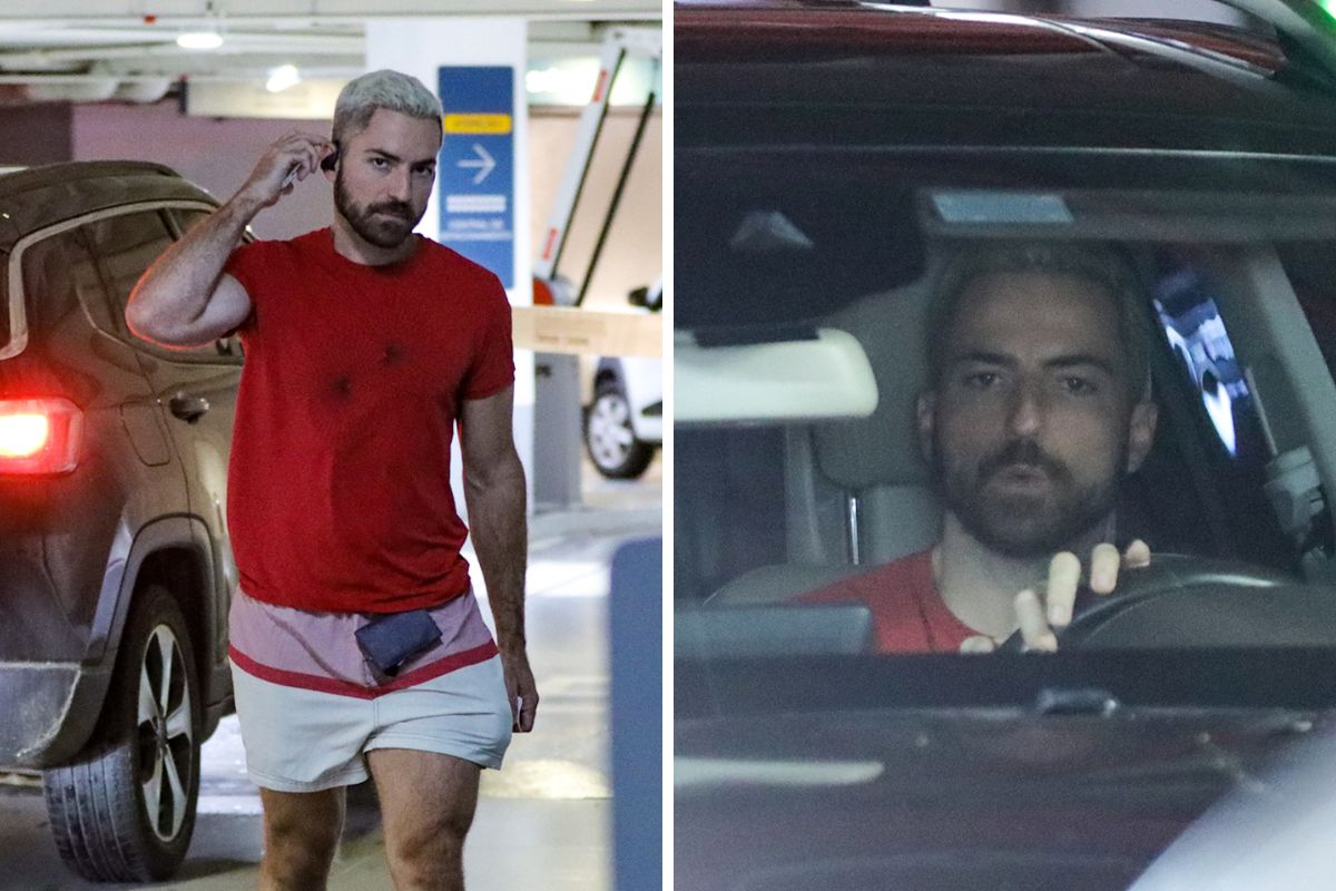 Thales Bretas em shopping com look em tons de vermelho