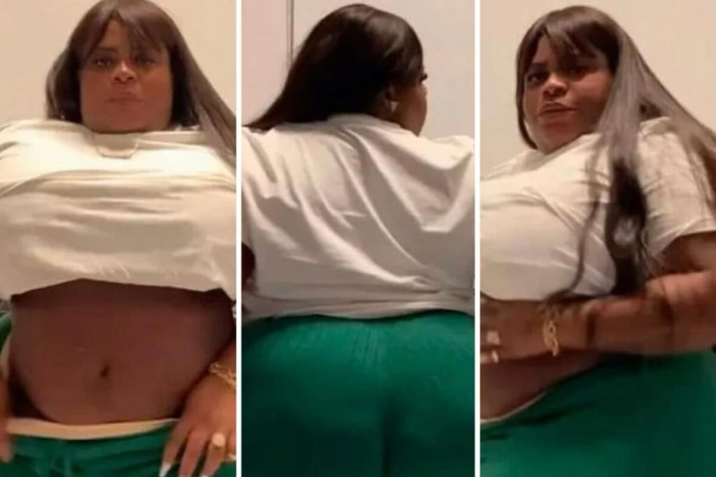 Jojo Todynho de calça verde e camisa branca exibe barriga e bumbum