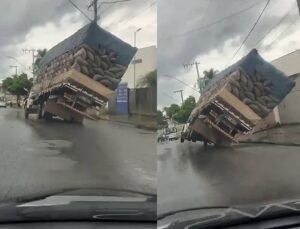 Caminhão carregado de carvão tomba e atinge residência; VEJA VÍDEO